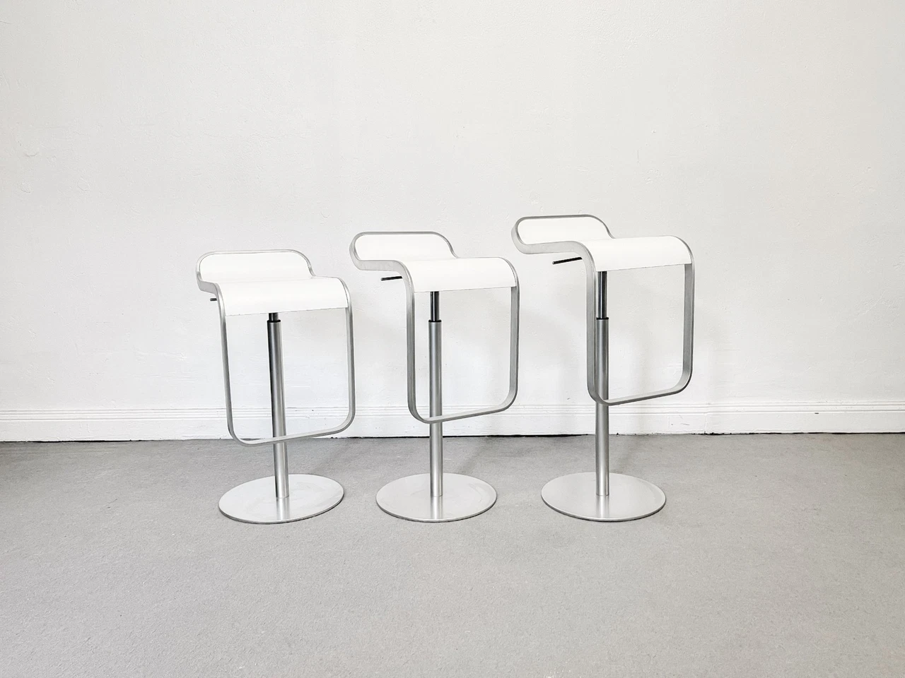 La Palma LEM height adjustable stool white seat with silver hardware, three stools side by side
